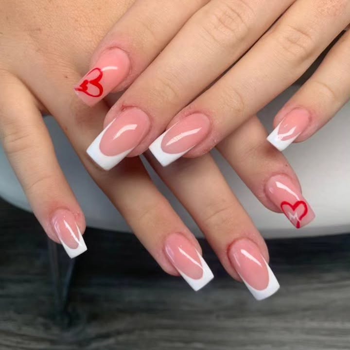 White French Manicure with Delicate Red Heart Detailing